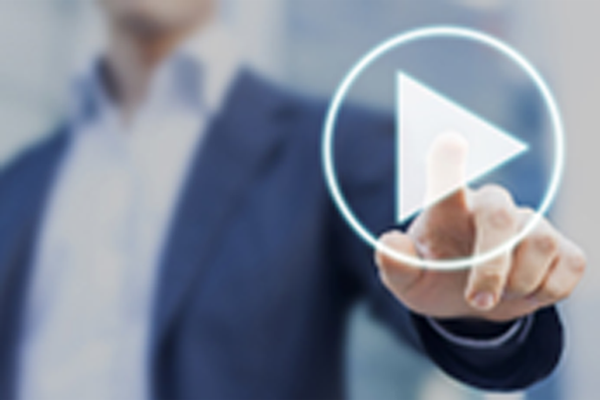 A person touching a play button